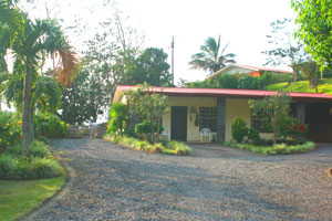 The owner's home and a caretaker apartment are below the hillside lots not far from the gate.